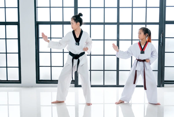 Two students practicing Taekwondo